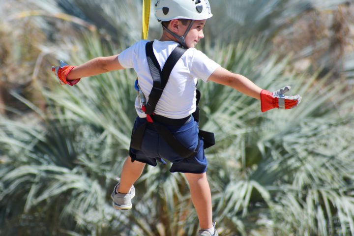 a young boy jumping in the air