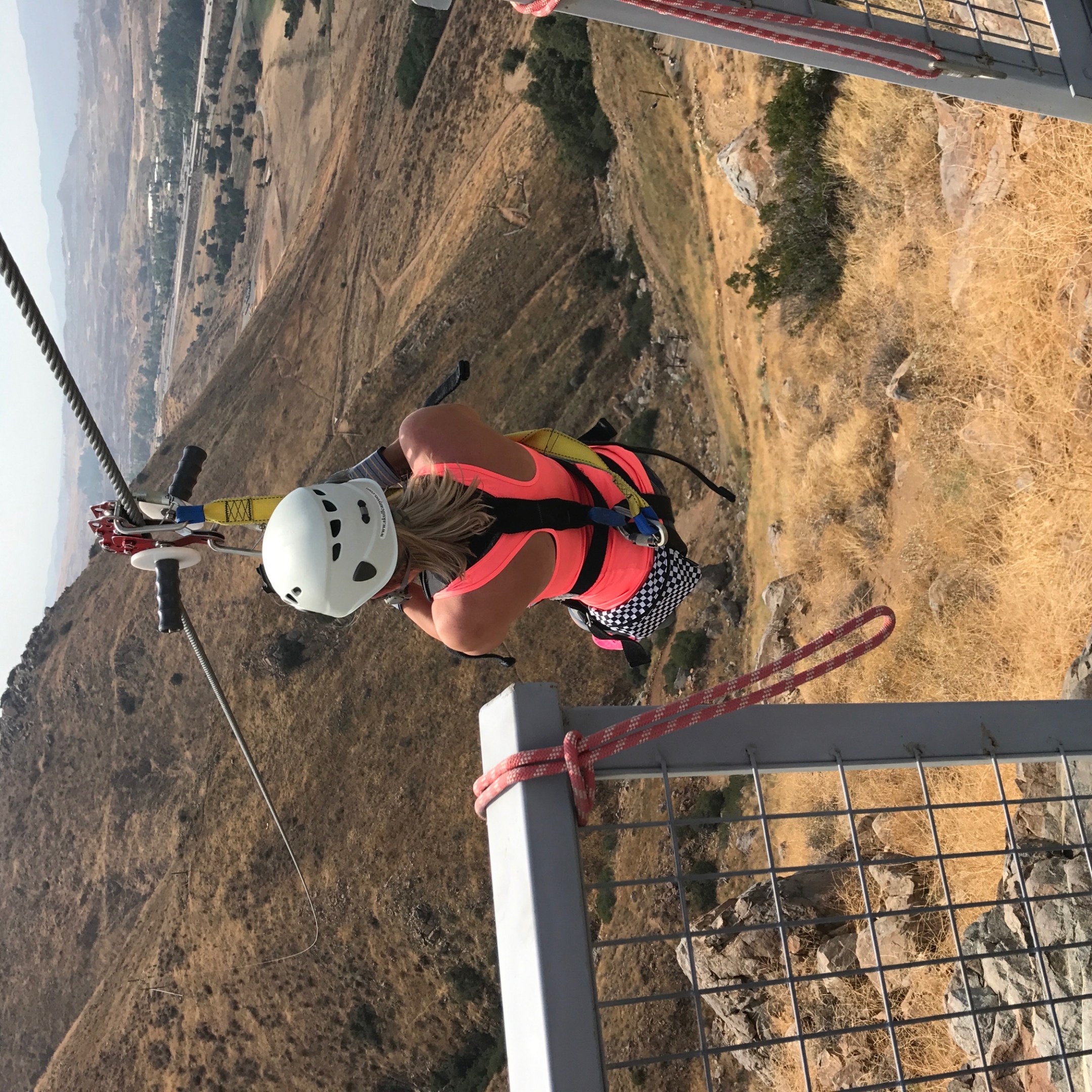 a person sitting on top of a mountain