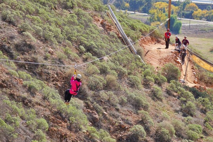 a group of people on a rocky hill