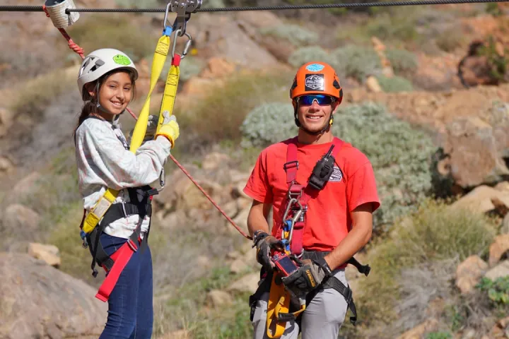 a couple of people that are standing in the dirt
